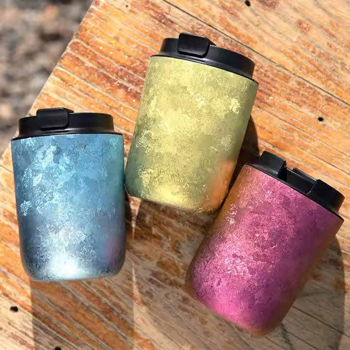 Spill-Proof Titanium Travel Cup with a leak-proof lid in vibrant gradient colors. Durable, insulated, and perfect for hot or cold beverages on the go.